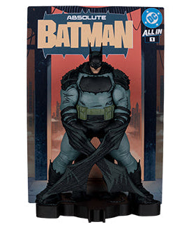 Batman Absolute All-In #1 action figure in its original packaging, featuring Batman in a crouched pose on a display base against a white background.